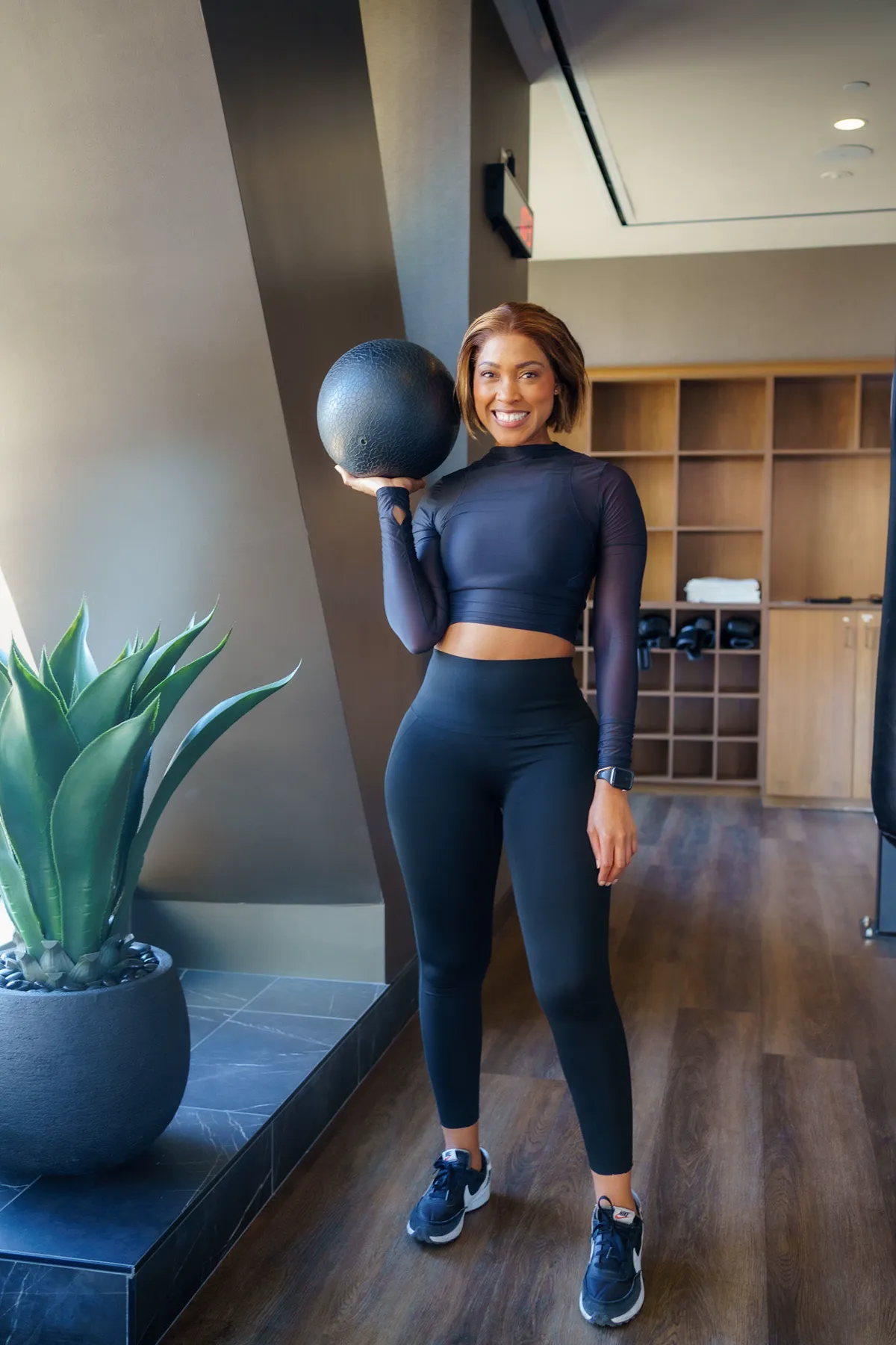 Coach Rea holding a medicine ball